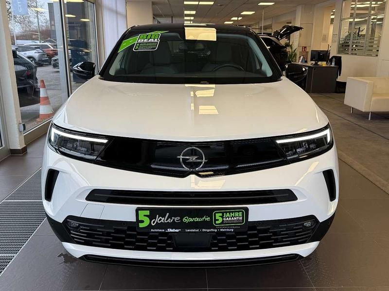 Gebraucht Opel Mokka-e Elegance 100 kW (136 PS) 2023 Lack weiss banquise/typ aussen SUV