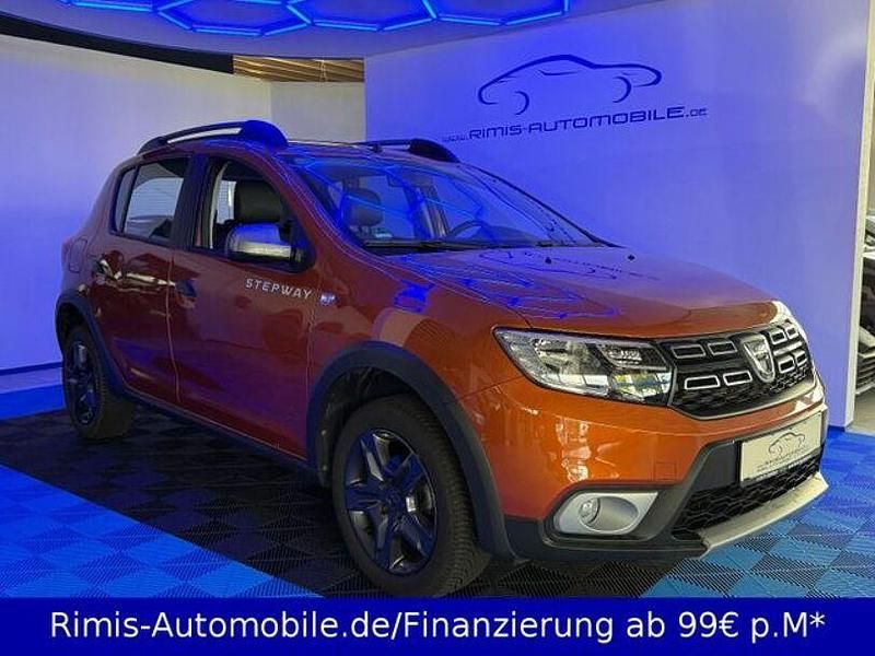 Orange Gebraucht 2017 Dacia Sandero Celebration SUV | 10.699 € (Fairer Preis) - Bild 1/4