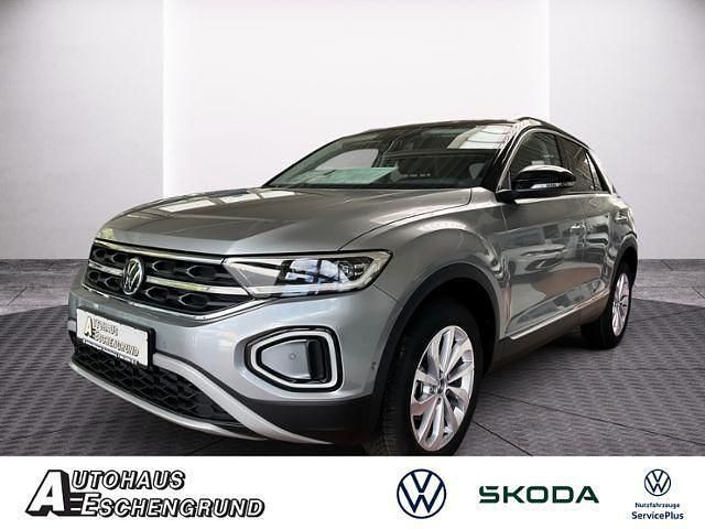 Pyritsilber metallic / schwar Neu 2025 VW T-Roc IQ Drive SUV | 40.734 € (Fairer Preis) - Bild 1/4