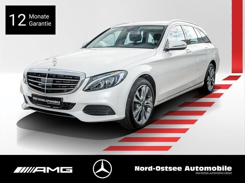Manufaktur diamantweiß bright Gebraucht 2018 Mercedes C200 Exclusive Kombi | 21.490 € (Fairer Preis) - Bild 1/4