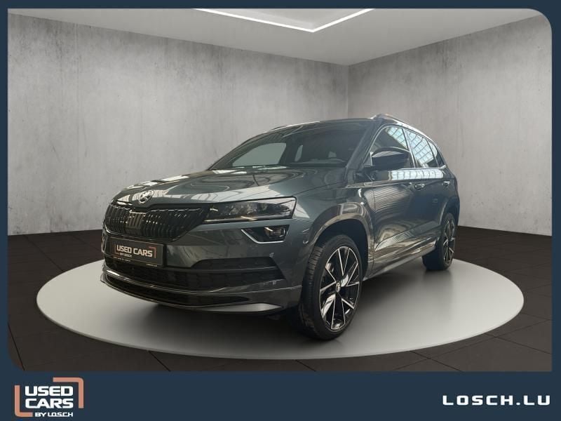 Grau Gebraucht 2021 Skoda Karoq SportlinePlus SUV | 29.490 € (Fairer Preis) - Bild 1/4