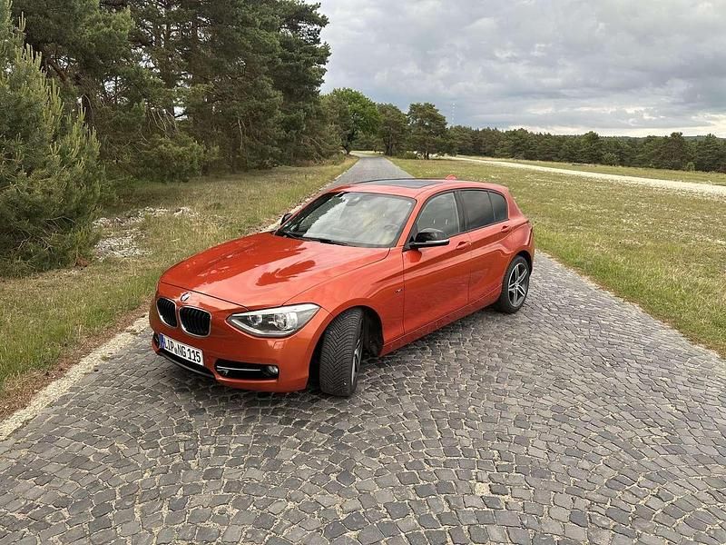 Orange Gebraucht 2012 BMW 120 Sport Line Kleinwagen | 8.900 € (Fairer Preis) - Bild 1/4