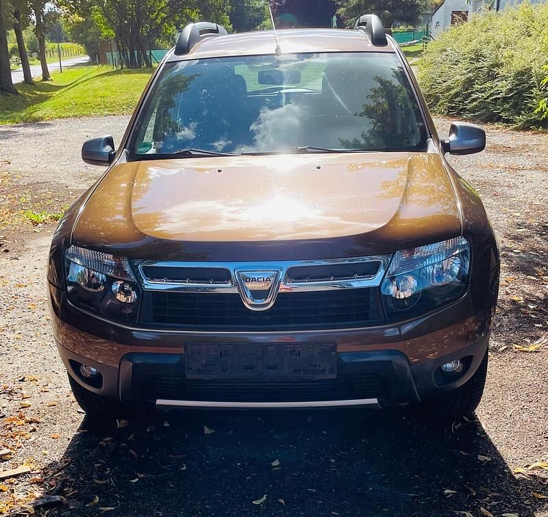 Braun Gebraucht 2013 Dacia Duster SUV | 6.999 € - Bild 1/4