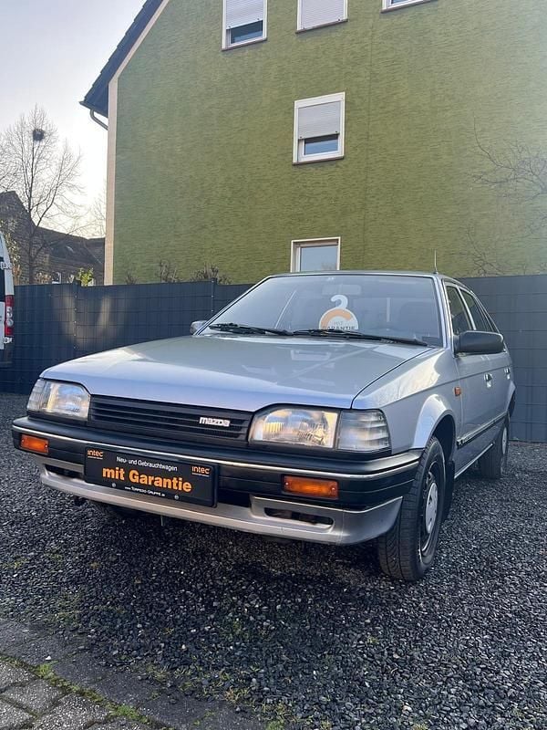 Silber Gebraucht 1989 Mazda 323 Limousine | 4.399 € - Bild 1/4