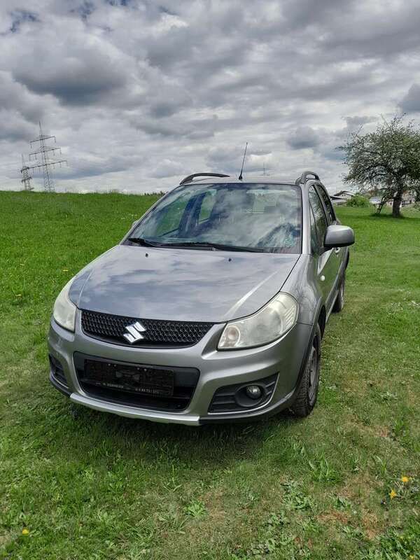 Grau Gebraucht 2011 Suzuki SX4 Comfort Limousine | 5.500 € (Fairer Preis) - Bild 1/4