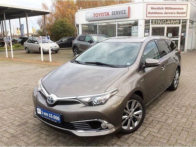 Platinumbronze metallic Gebraucht 2016 Toyota Auris Hybrid Executive Kombi | 15.950 € (Fairer Preis) - Bild 1/4