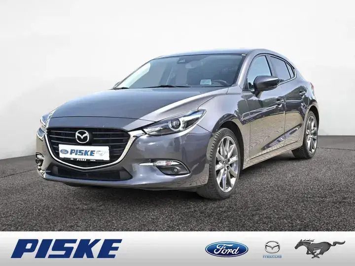 Machine gray Gebraucht 2018 Mazda 3 Sports-Line Kleinwagen | 15.190 € (Fairer Preis) - Bild 1/3