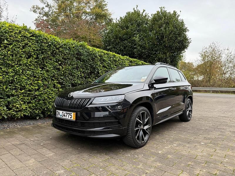 Schwarz Gebraucht 2019 Skoda Karoq SportLine SUV | 25.800 € (Fairer Preis) - Bild 1/4