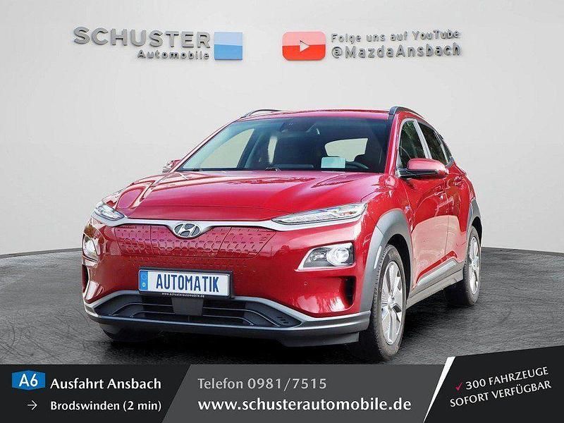 Sunset red / mic (metallic) Gebraucht 2021 Hyundai Kona Premium SUV | 18.980 € (Guter Preis) - Bild 1/4