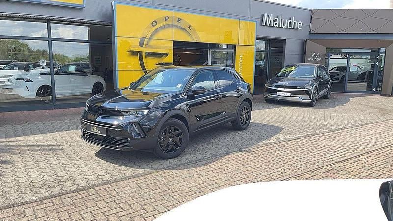 Karbon schwarz (metallic) Gebraucht 2024 Opel Mokka SUV | 29.790 € (Teuer) - Bild 1/4