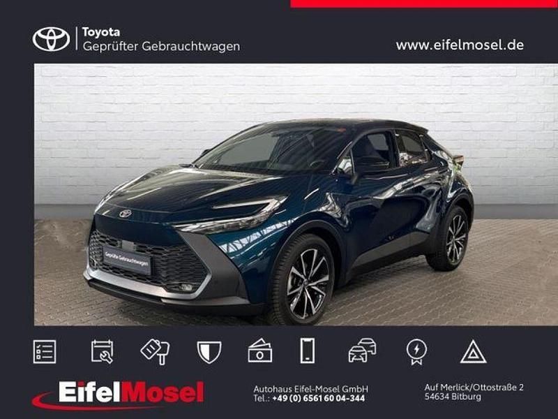 Midnight teal metallic/ dach schwarz Gebraucht 2024 Toyota C-HR Team SUV | 28.890 € - Bild 1/4