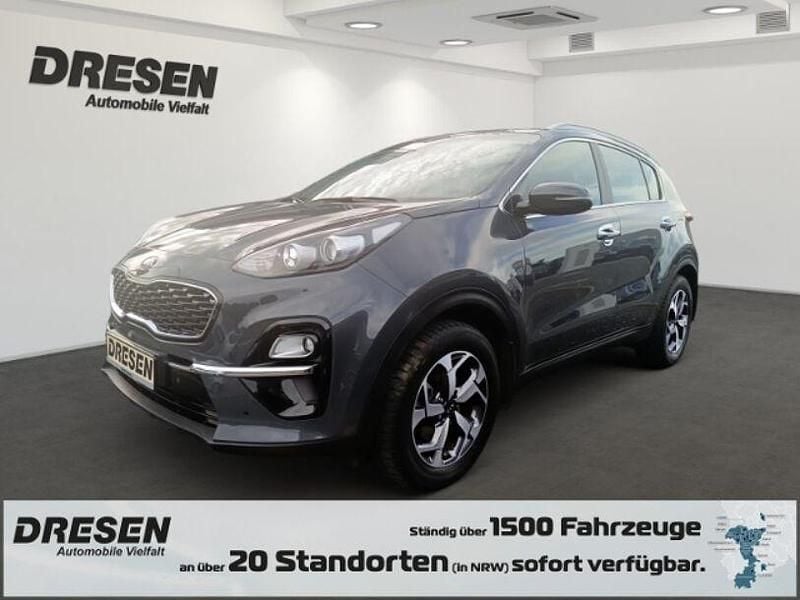 H8g) pentametal met. (grau Gebraucht 2019 Kia Sportage Vision SUV | 17.980 € (Fairer Preis) - Bild 1/4