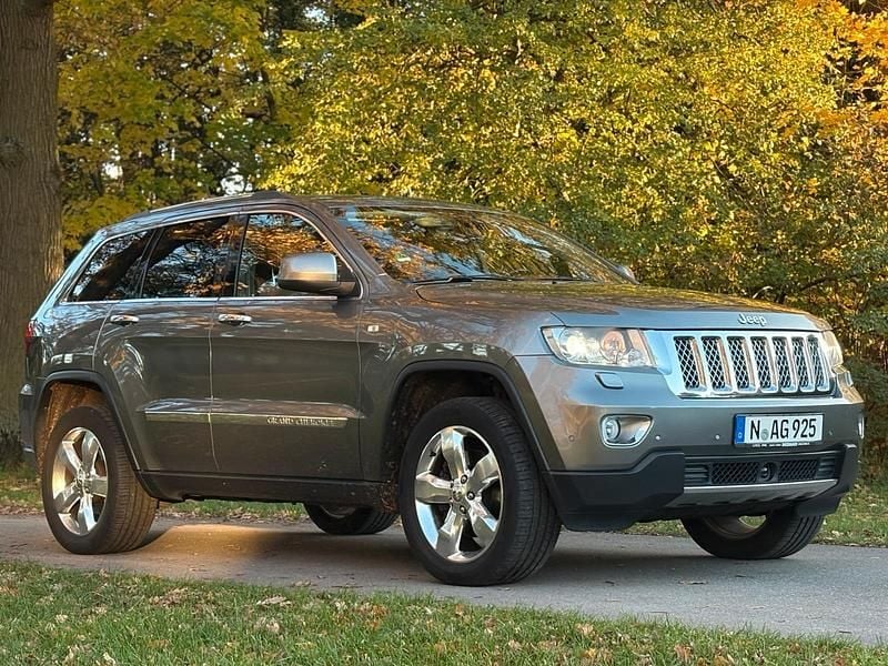 Andere farben Gebraucht 2012 Jeep Grand Cherokee Summit SUV | 9.300 € (Fairer Preis) - Bild 1/4