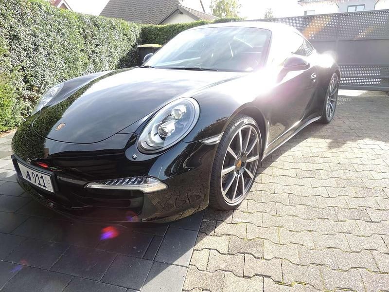 Schwarz Gebraucht 2015 Porsche 911 Carrera 4 Black Edition Coupé | 83.911 € (Superpreis) - Bild 1/4