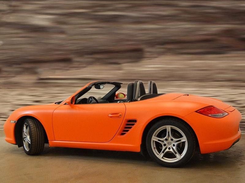 Gebraucht Porsche Boxster 256 PS (188 kW) 2009 Mattorange (foliert) / arktis Cabrio