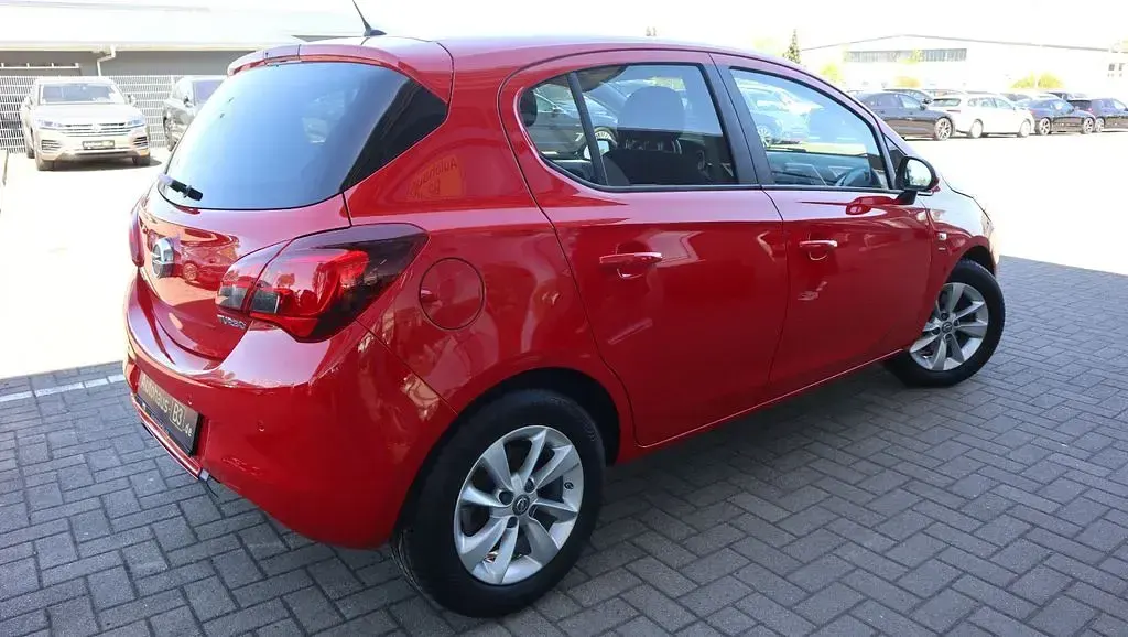 Używany Opel Corsa drive 101 KM (74 kW) 2016 Czerwony Hatchback