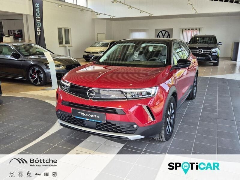 Power rot/kosmos rot Gebraucht 2021 Opel Mokka-e Elegance SUV | 17.490 € (Fairer Preis) - Bild 1/4