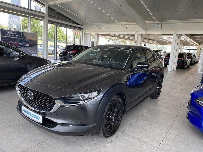 Machine gray Gebraucht 2024 Mazda CX-30 Homura-Line SUV | 29.500 € (Fairer Preis) - Bild 1/4