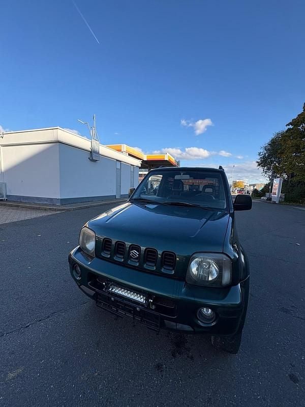 Grün Gebraucht 2004 Suzuki Jimny SUV | 3.300 € (Superpreis) - Bild 1/4