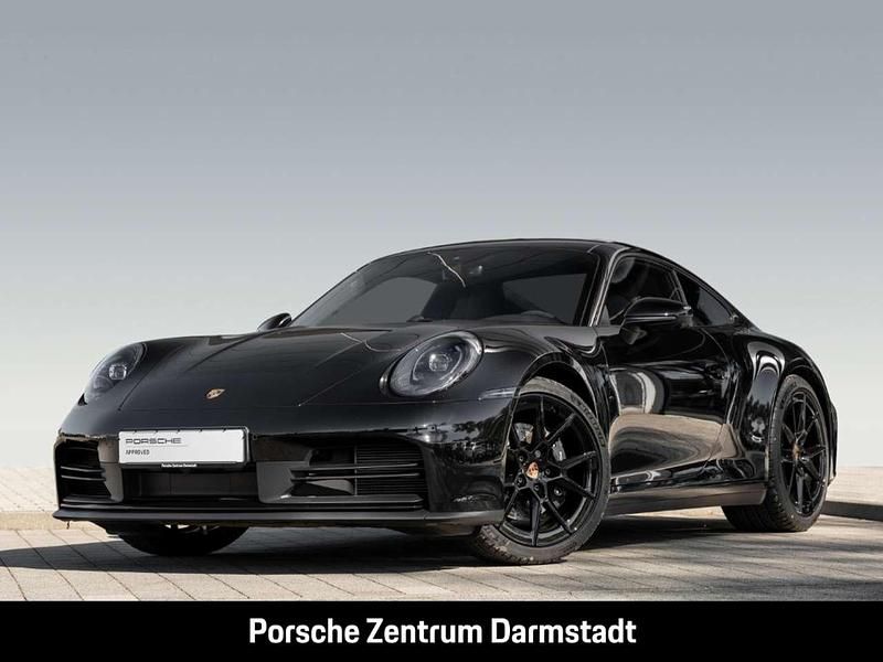 Tiefschwarzmetallic Gebraucht 2024 Porsche 911 Carrera Coupé | 137.499 € - Bild 1/4
