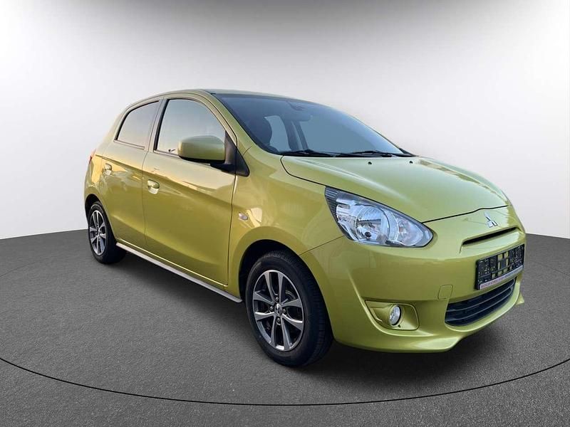 Karambolagelb Gebraucht 2015 Mitsubishi Space Star Diamant Edition Kleinwagen | 5.390 € (Fairer Preis) - Bild 1/4