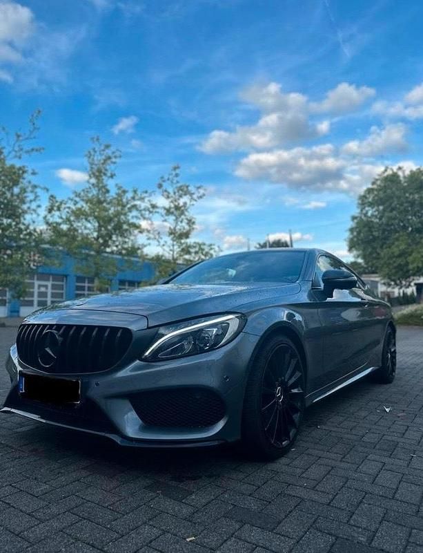 Grau Gebraucht 2018 Mercedes C250 AMG line Coupé | 26.999 € (Teuer) - Bild 1/4