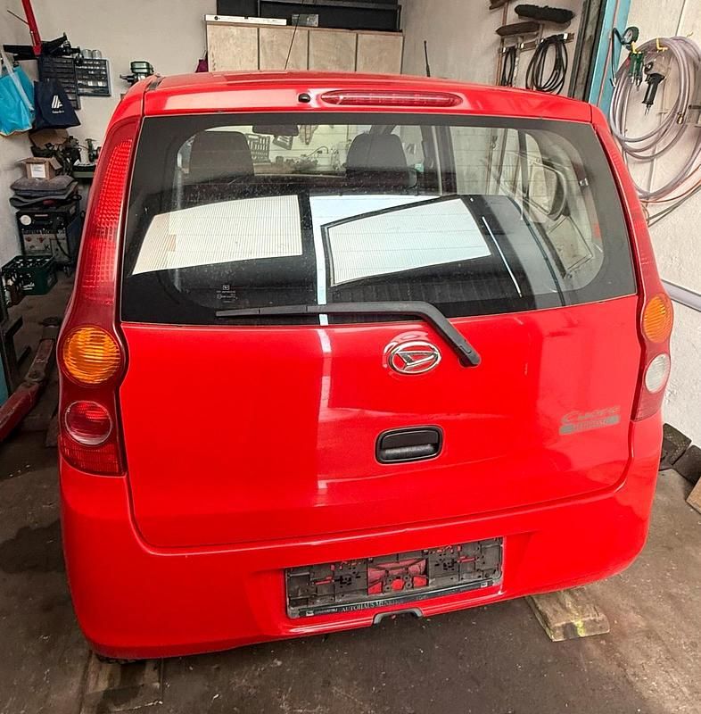Gebraucht Daihatsu Cuore 70 PS (51 kW) 2009 Rot Kleinwagen