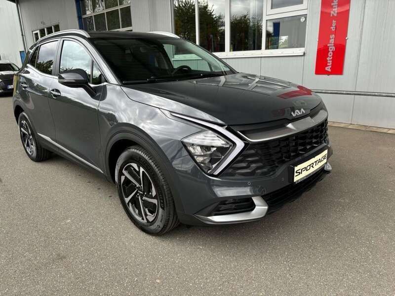 Grau Neu 2024 Kia Sportage Comfort SUV | 31.990 € (Etwas zu teuer) - Bild 1/4