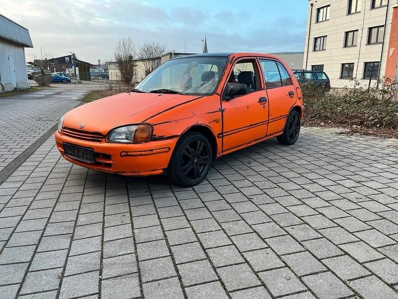 Gebraucht Toyota Starlet 75 PS (55 kW) 1996 Orange Kleinwagen