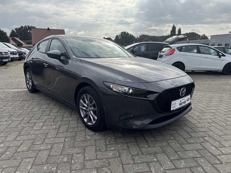 Machine grey metallic Gebraucht 2021 Mazda 3 Selection Limousine | 18.750 € - Bild 1/4