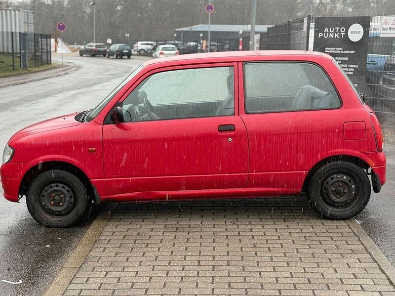 Gebraucht Daihatsu Cuore 56 PS (41 kW) 2000 Rot Kleinwagen