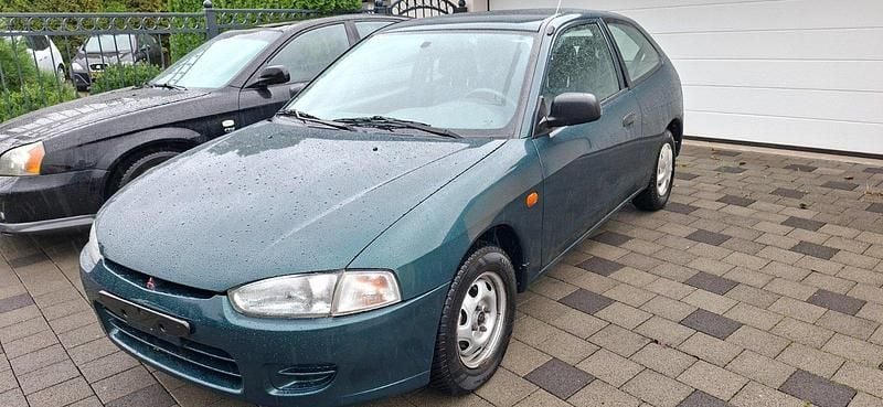 Grün Gebraucht 1997 Mitsubishi Colt Kleinwagen | 1.699 € - Bild 1/4
