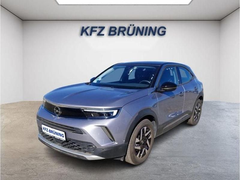 Kontrast grau metallic / d (metallic) Gebraucht 2023 Opel Mokka-e Elegance SUV | 18.480 € (Guter Preis) - Bild 1/4
