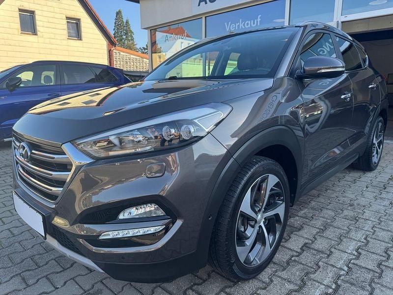 Grau Gebraucht 2016 Hyundai Tucson Premium SUV | 18.490 € (Fairer Preis) - Bild 1/4