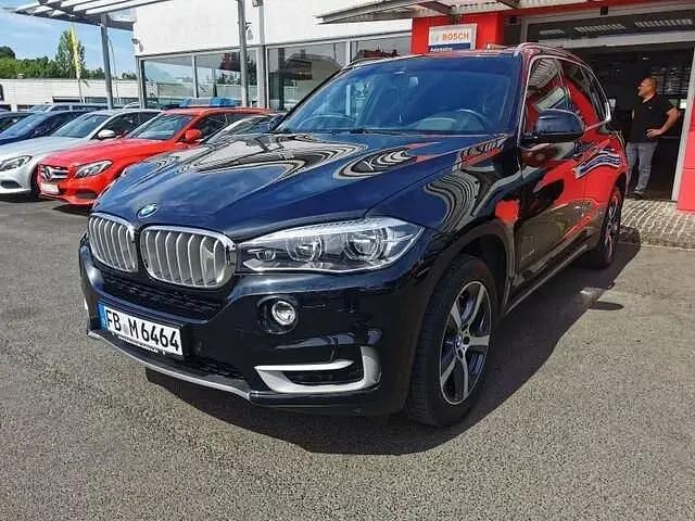 Black sapphire metallic Gebraucht 2016 BMW X5 Performance SUV | 34.900 € - Bild 1/4