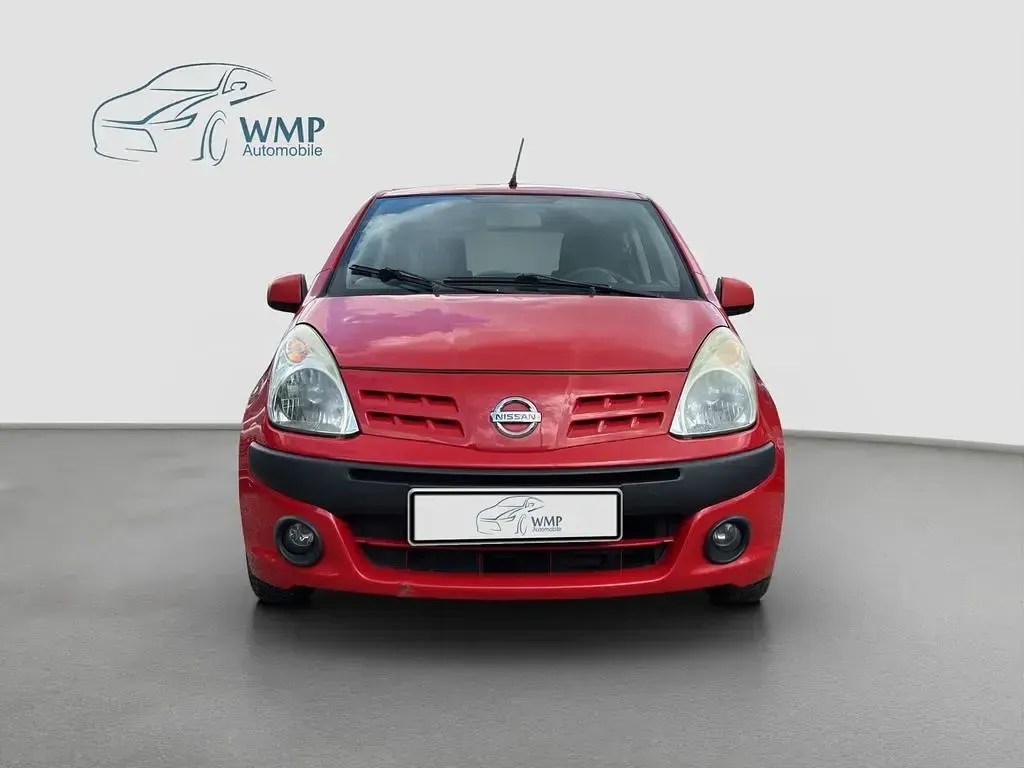Gebraucht Nissan Pixo Acenta 68 PS (50 kW) 2012 Bright red (s) Kleinwagen