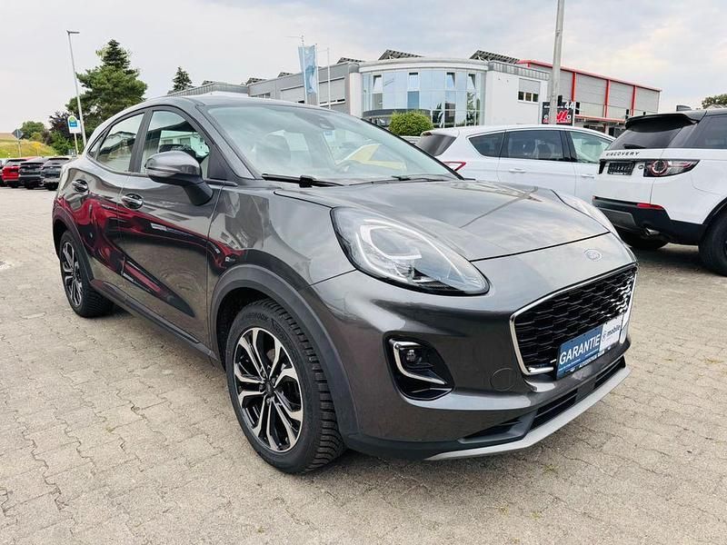 Grau Gebraucht 2022 Ford Puma Gen-E Cool & Connect SUV | 14.470 € (Superpreis) - Bild 1/4