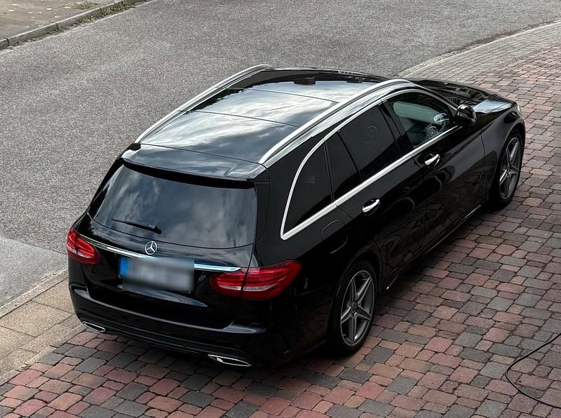 Schwarz Gebraucht 2017 Mercedes C250 AMG line Kombi | 23.990 € (Fairer Preis) - Bild 1/4