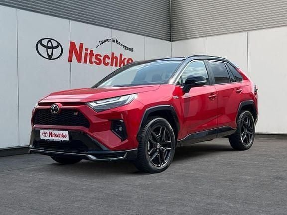 Kaminarot metallic Gebraucht 2023 Toyota RAV4 Hybrid Sport SUV | 57.990 € - Bild 1/4