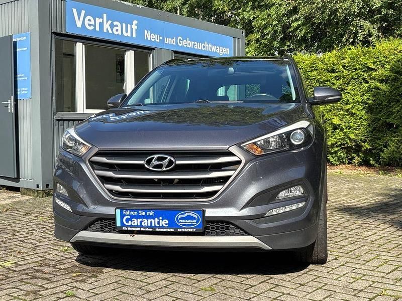 Grau Gebraucht 2018 Hyundai Tucson Passion Plus SUV | 15.900 € (Fairer Preis) - Bild 1/4