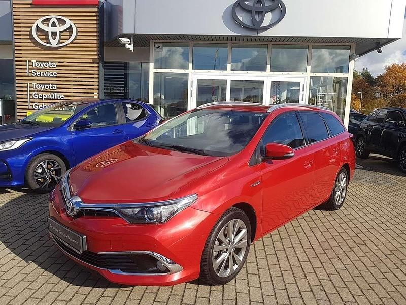 Navachorot mica metallic Gebraucht 2016 Toyota Auris Hybrid Executive Kombi | 15.150 € (Fairer Preis) - Bild 1/4
