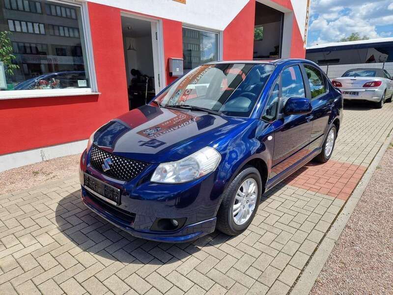 Blau Gebraucht 2010 Suzuki SX4 Comfort Limousine | 5.480 € (Fairer Preis) - Bild 1/4