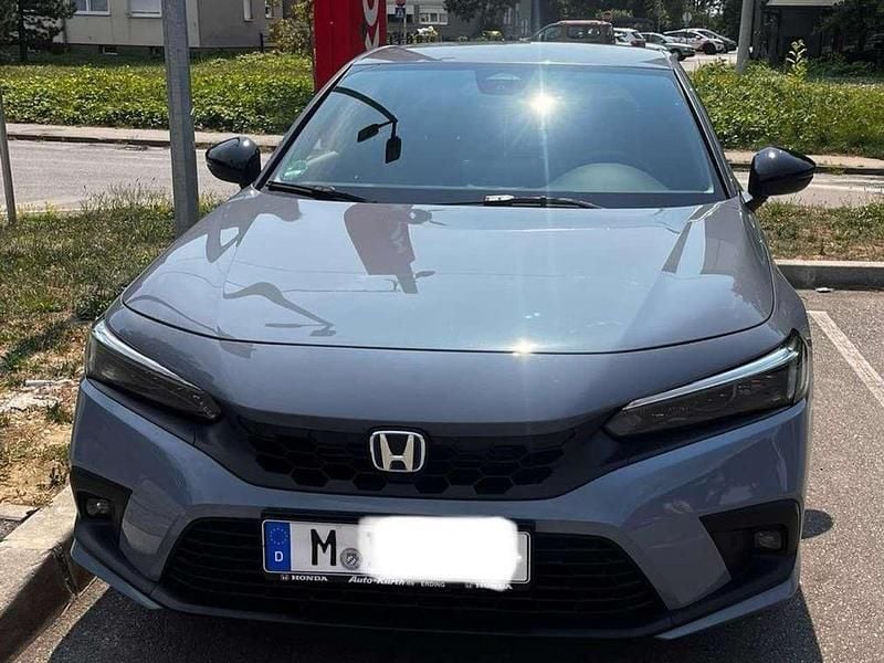 Grau Gebraucht 2023 Honda Civic Hybrid Limousine | 34.900 € (Teuer) - Bild 1/4