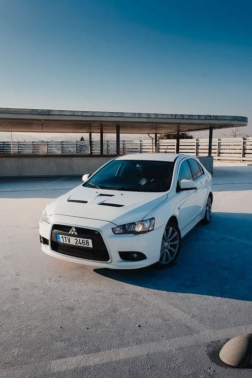 Weiß Gebraucht 2010 Mitsubishi Lancer Limousine | 16.150 € (Fairer Preis) - Bild 1/4