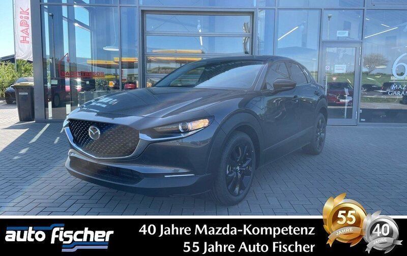 Machine gray Neu 2024 Mazda CX-30 Homura-Line SUV | 28.990 € - Bild 1/4