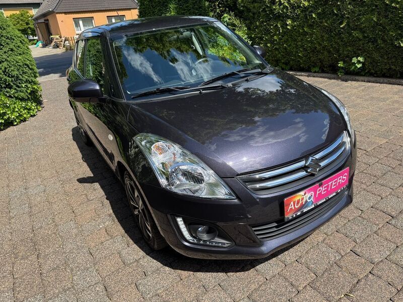 Grau Gebraucht 2015 Suzuki Swift X-TRA Limousine | 8.480 € (Superpreis) - Bild 1/4