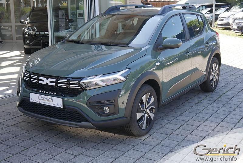 Gebraucht Dacia Sandero Expression 91 PS (66 kW) 2024 Safarigrüngrau metallic Kleinwagen