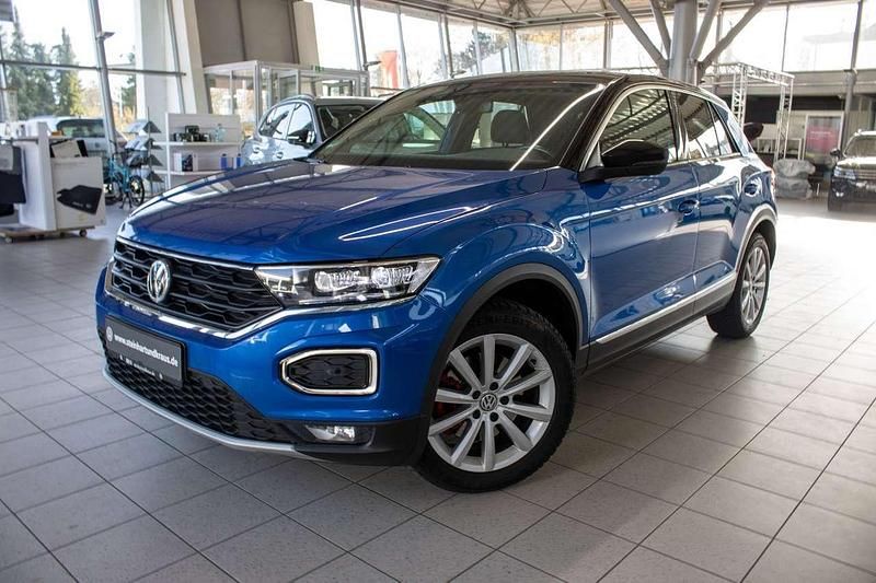 Ravennablau metallic (metallic) Gebraucht 2020 VW T-Roc Active SUV | 21.390 € (Fairer Preis) - Bild 1/4