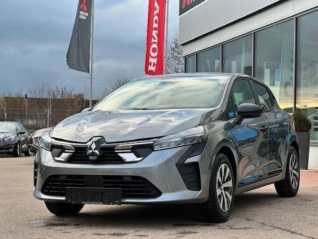 Grau Gebraucht 2024 Mitsubishi Colt Basis Limousine | 15.995 € (Fairer Preis) - Bild 1/4