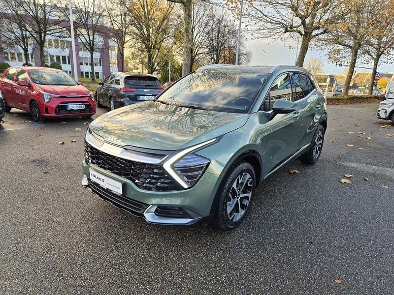 Experience green metallic Gebraucht 2025 Kia Sportage Spirit SUV | 31.900 € (Superpreis) - Bild 1/4